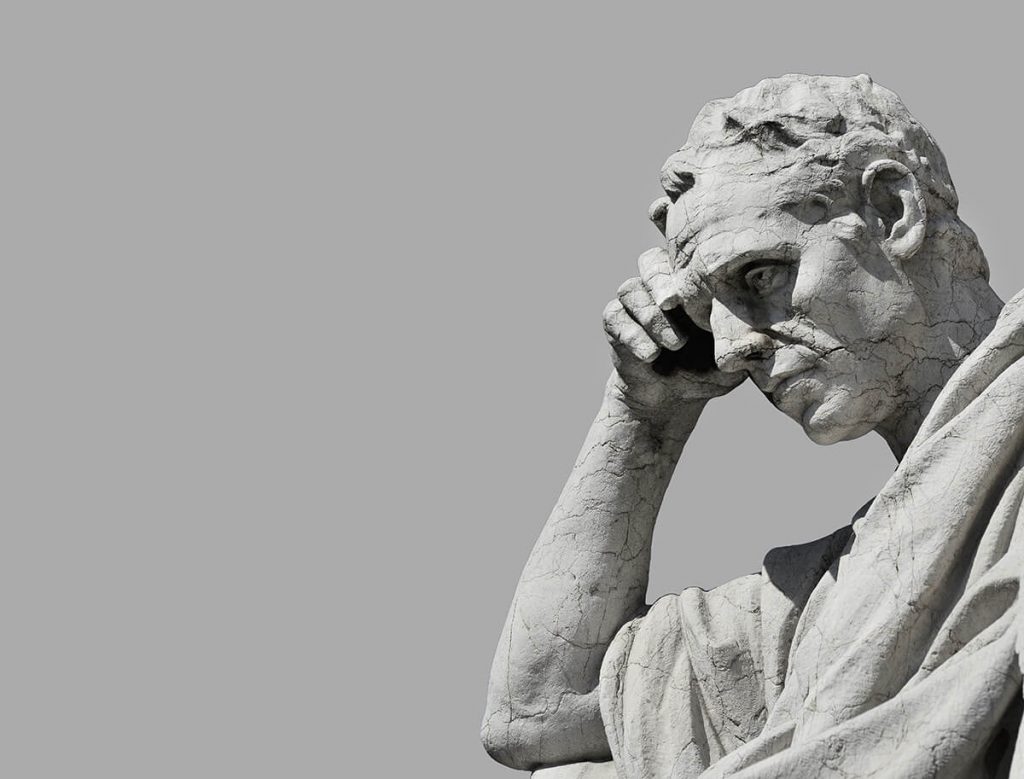 A statue that looks deep in thought