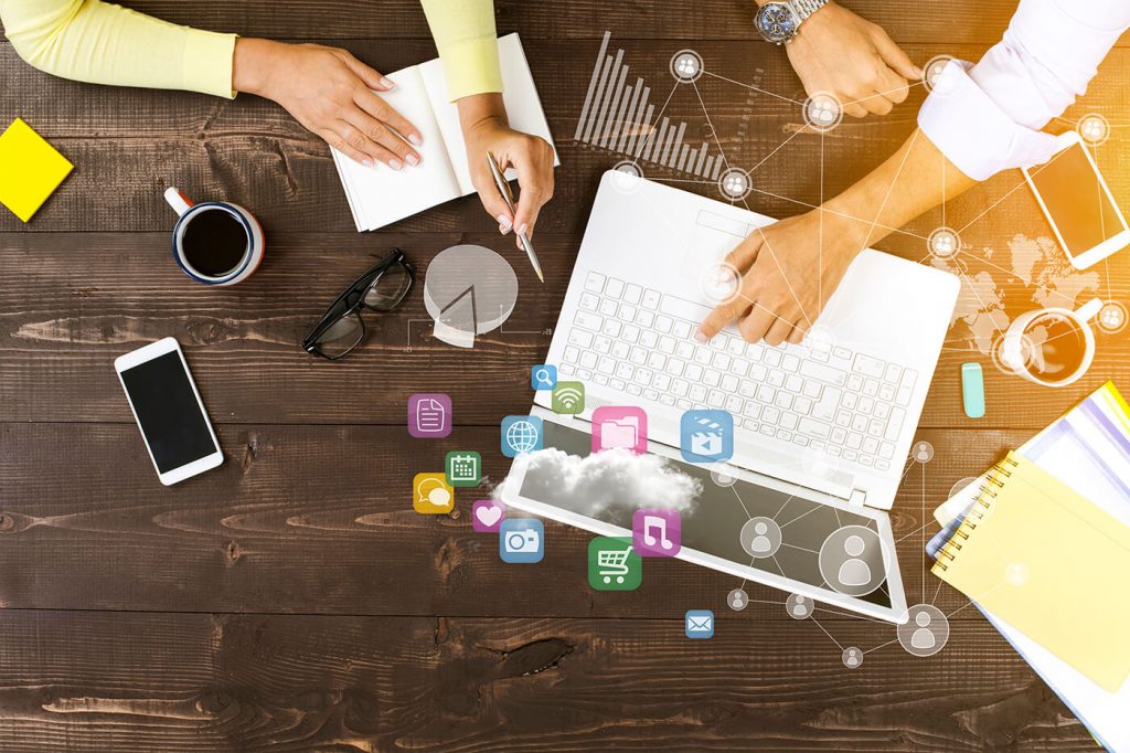 Two people working on a computer