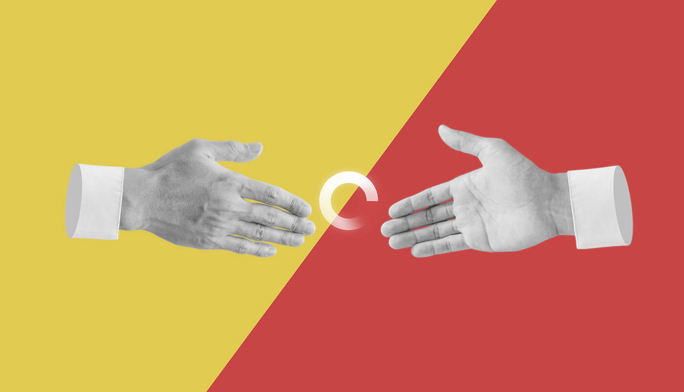 Two hands about to shake with a loading sign in between them